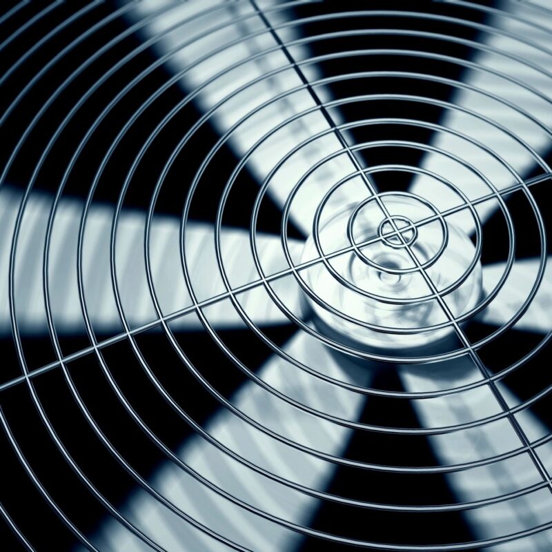 Close-up of HVAC air conditioner fan blades in motion — Canfield AC services Grand Rapids