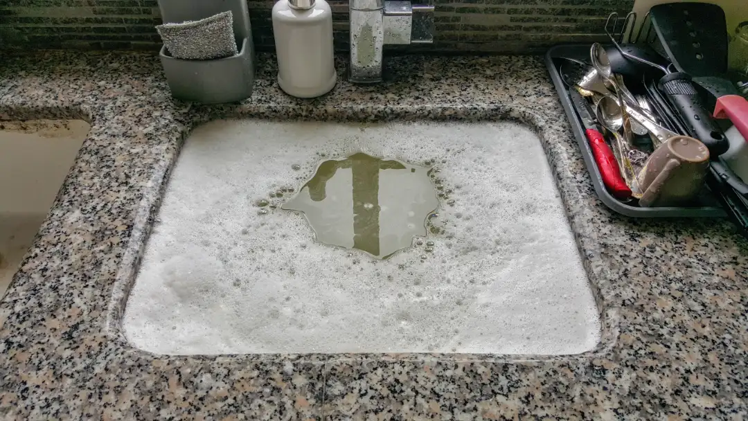 A clogged kitchen sink